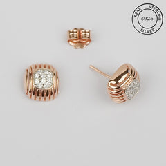 A pair of rose gold cushion-shaped stud earrings with zircon stones, crafted from 925 sterling silver, displayed against a white background.