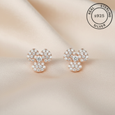 Rose gold earrings with AAA+ Zircon stones featuring 'Real Sterling Silver 925' stamp.