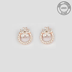 A pair of 925 sterling silver rose gold bloom stud earrings with zircon stones.