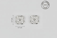 Pair of silver earrings with clovers eshowing dimensions and 'Real Sterling Silver' label.