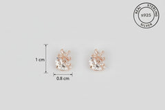 Rose gold earrings with AAA+ Cubic Zircona, featuring 'Real Sterling Silver' certification.