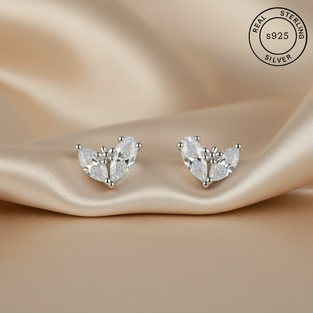 Silver earrings with marquise-shaped , featuring CZ zircons with 'Real Sterling Silver' stamp.