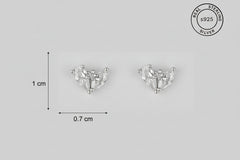Pair of silver heart-shaped stud earrings with 'Real Sterling Silver' stamp.