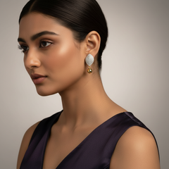 Woman wearing a pair of 925 Sterling Silver Gold Leaf Drop Dangles