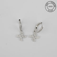 A pair of 925 sterling silver charm hoop earrings with a pinwheel design, featuring small cubic zirconia stones.