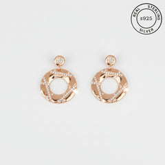 Rose gold hoop earrings with Ziroconia stones on a white background, featuring 'Real Sterling S925' label.