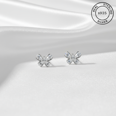 Butterfly-shaped silver earrings on a white background with 'Real Sterling Silver' label.
