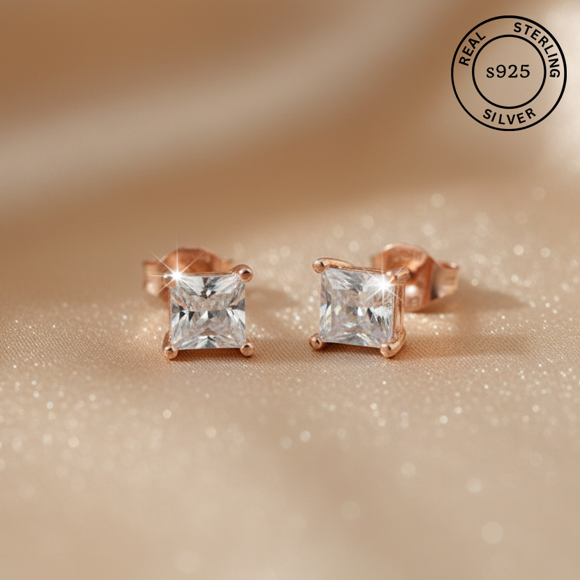 Rose gold stud earrings with AAA+ cubic zircona diamonds, featuring a 'Real Sterling Silver 925' stamp.