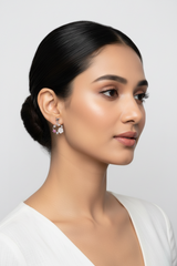 Woman with styled hair and 925 Sterling Silver Floral Bloom Pink Earrings
