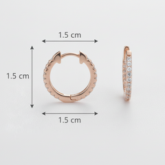 Rose gold hoop earrings with measurements on a light gray background