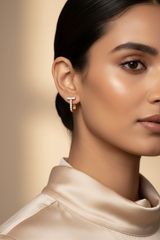 Close-up of a woman wearing 925 Sterling Silver Blue Hoops