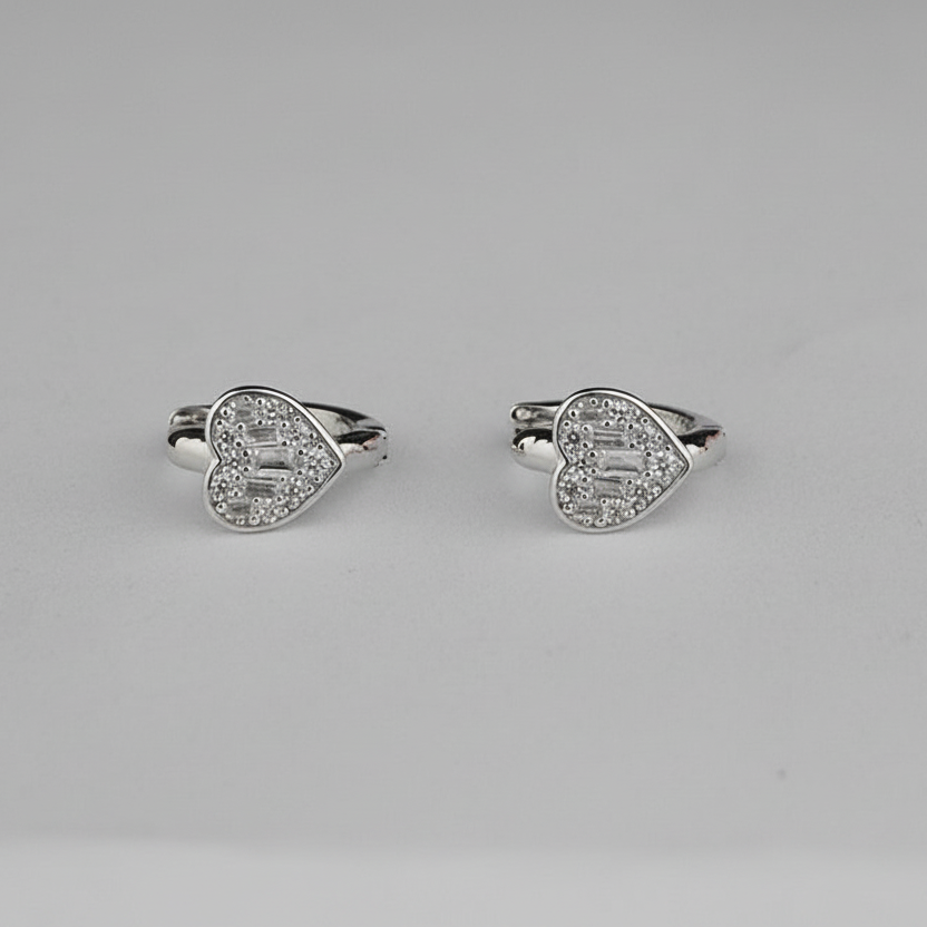 Pair of silver heart-shaped rings with gemstones
