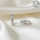 925 Sterling Silver Hoop Earrings
with diamond accents on a white fabric background, featuring 'Real Sterling Silver' certification.
