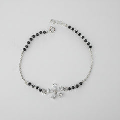 925 Sterling Silver Floral Black Bead Bracelet with black beads and silver clasp on a gray background