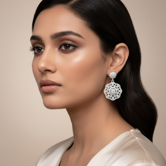 Woman wearing a floral earring -Silver Zircon Elegance Danglers