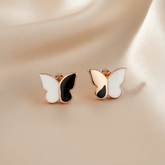Butterfly-shaped earrings with rose gold frame