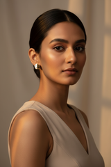 Woman wearing 925 Sterling Silver gold earrings