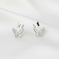 Butterfly-shaped silver earrings with clear gemstones