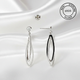Silver earrings on a white background with 'Real Sterling S925' label.