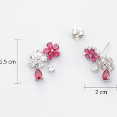Silver earrings with pink floral and teardrop designs, shown with measurements on a white background.