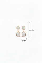 Pair of earrings with measurements on a white background