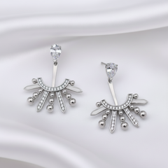 Pair of silver earrings with decorative design on a white background