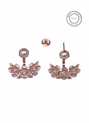 Rose gold floral earrings with pearls on a white background