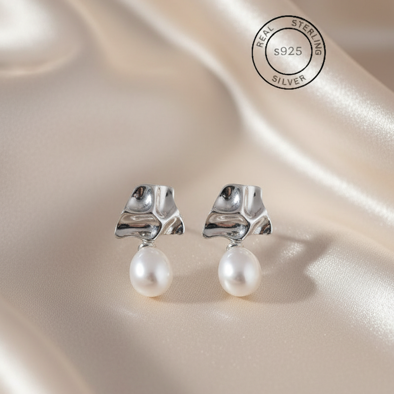 Silver Lava Pearl Drop Dangles with pearls on a satin surface, featuring 'Real Sterling Silver' certification.