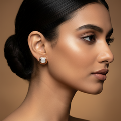 Close-up of a woman wearing 925 Sterling Silver Rose Gold Luxe Cushion Studs