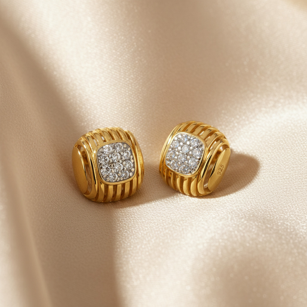 Pair of gold earrings with diamond accents 