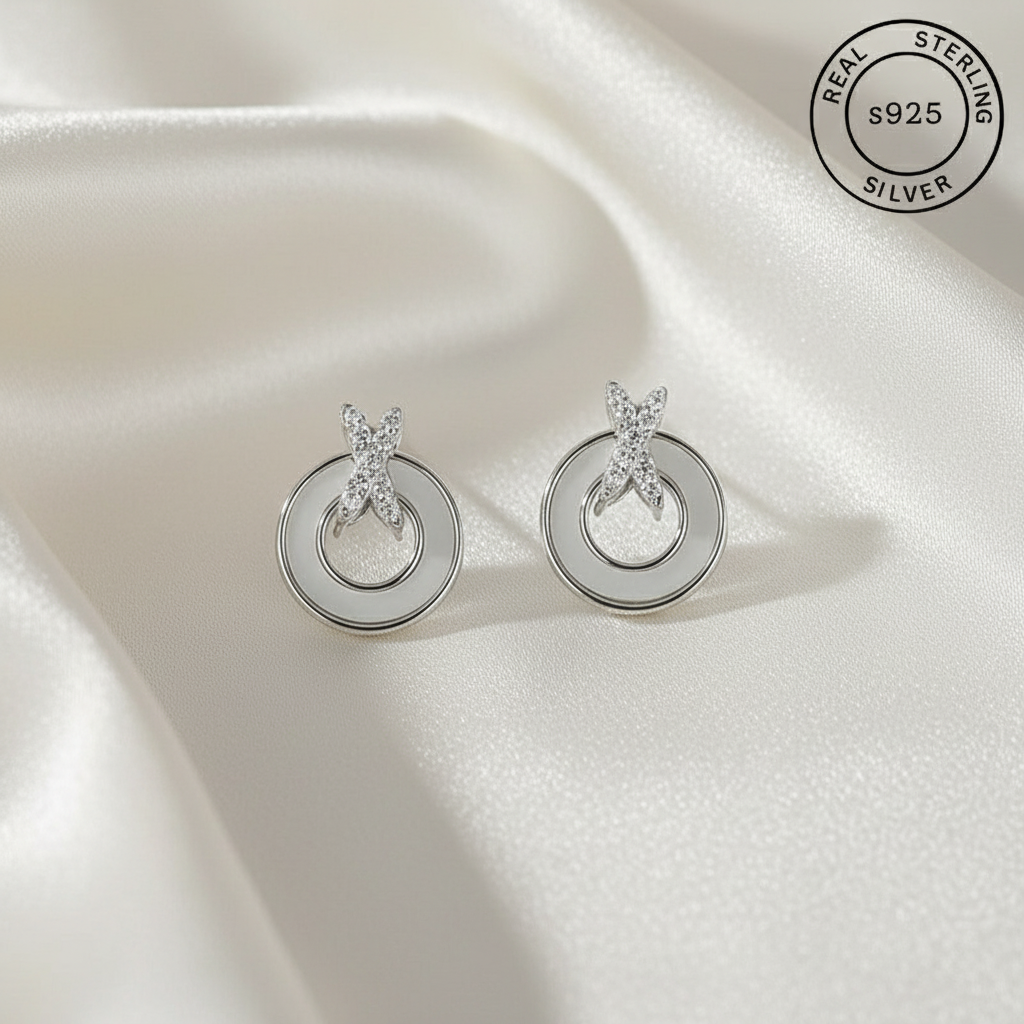 925 Sterling Silver Mother Of Pearl Studs with 'Real Sterling Silver' label.