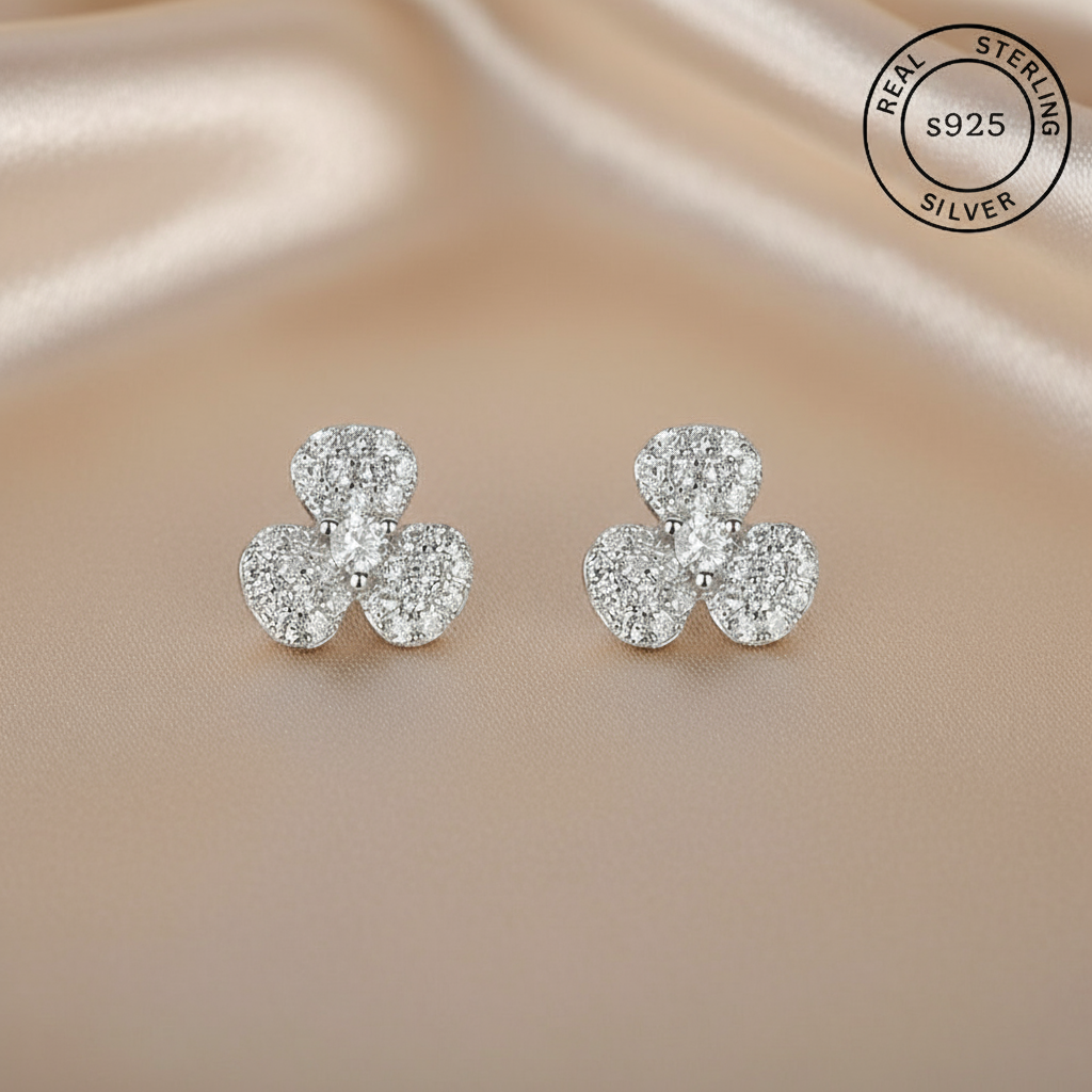 925 Sterling Silver Sparkling Studs
with 'Real Sterling Silver' stamp.