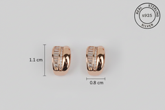 Rose gold earrings with zircon stones on a light gray background, showing measurements and 'Real Sterling Silver' certification.