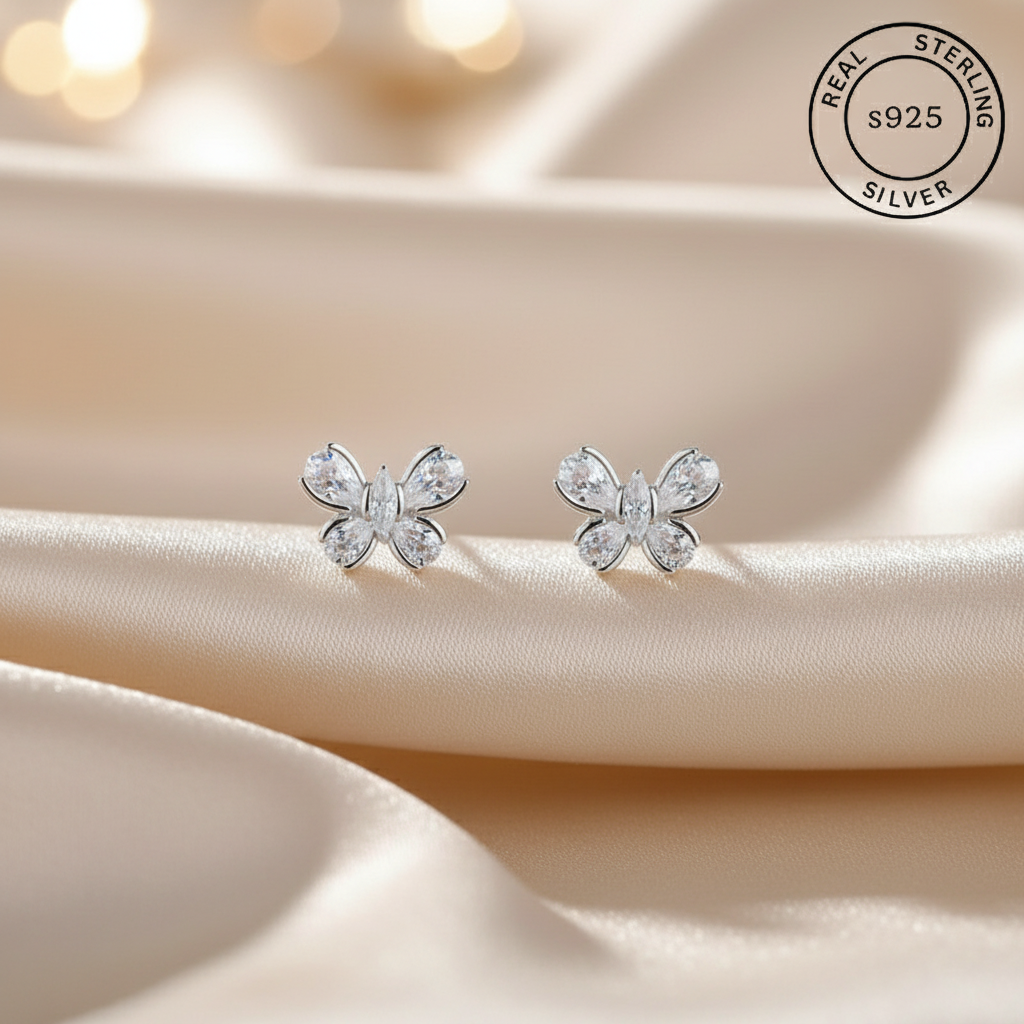 Butterfly-shaped silver earrings with 'Real Sterling Silver s925' label.