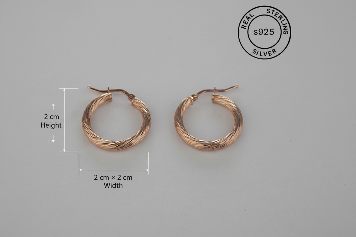 Rose gold hoop earrings with measurements and 'Sterling Silver' stamp on a gray background