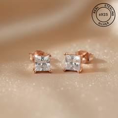 Rose gold stud earrings with AAA+ cubic zircona diamonds, featuring a 'Real Sterling Silver 925' stamp.