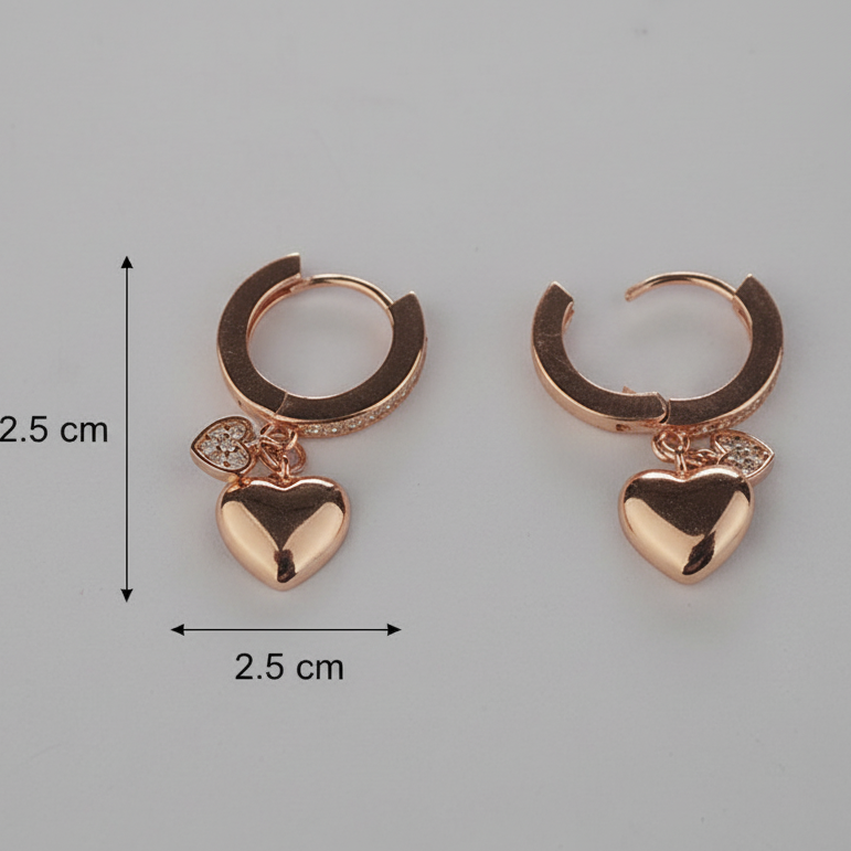 Rose gold hoop earrings with heart charms