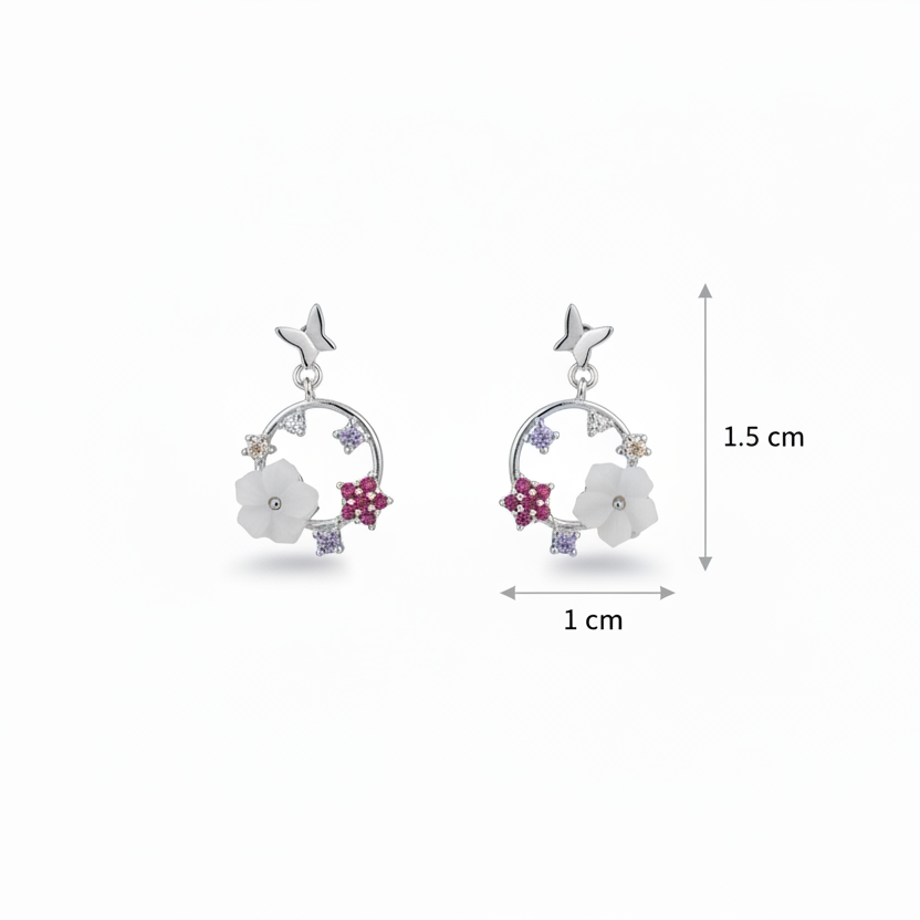 Silver earrings with floral designs and measurements on a white background