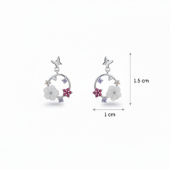 Silver earrings with floral designs and measurements on a white background