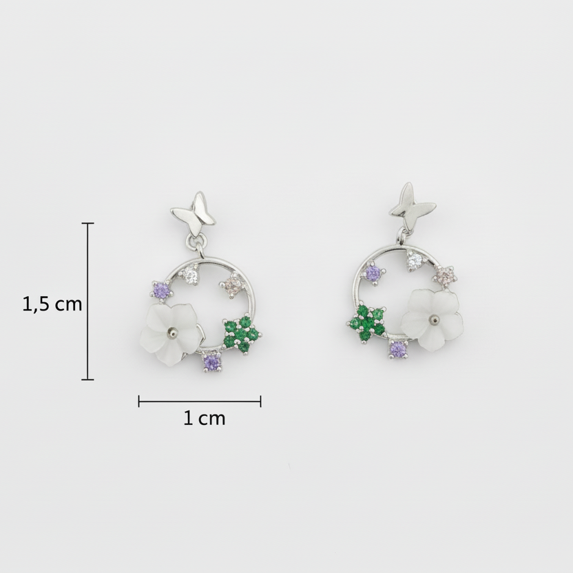 Pair of earrings with floral designs and measurements on a white background
