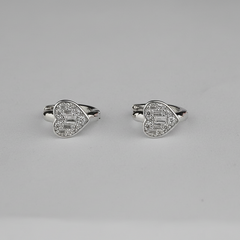 Pair of silver heart-shaped rings with gemstones 