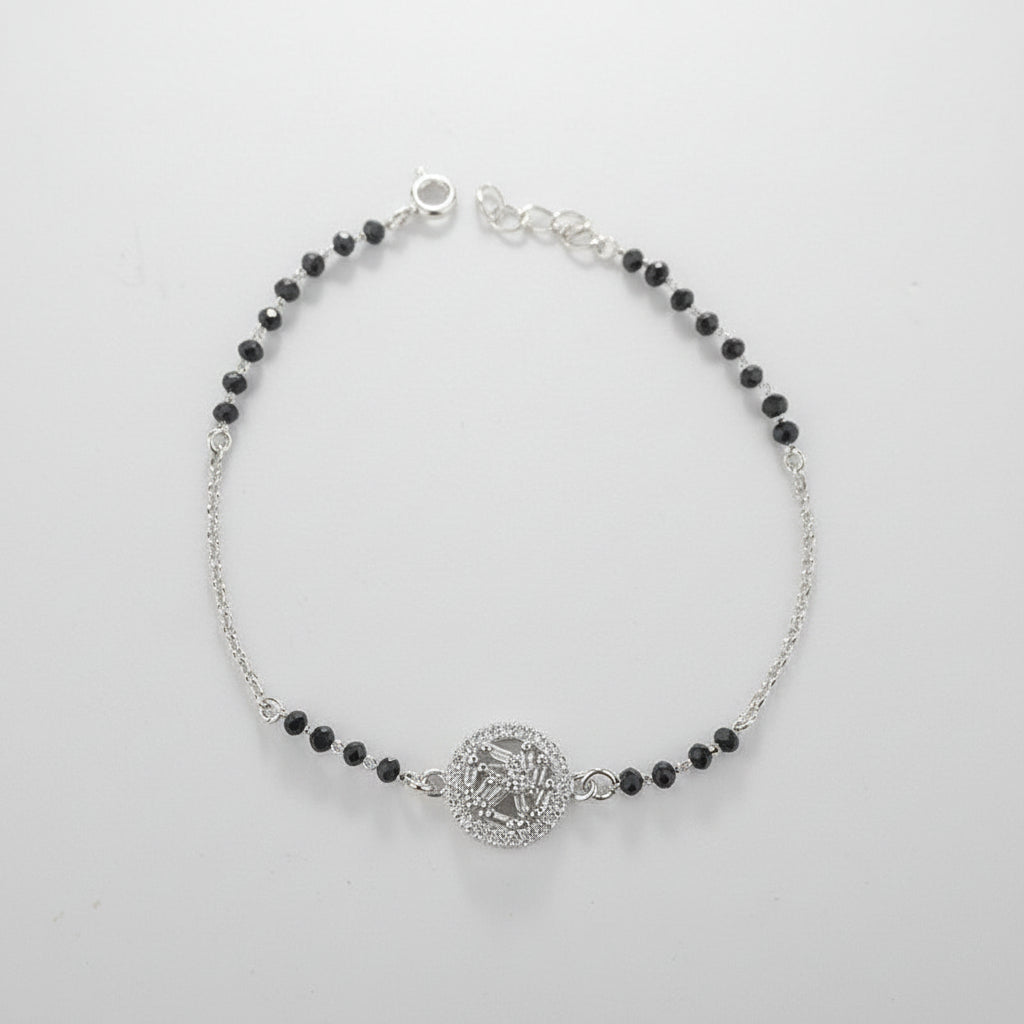 925 Sterling Silver Black Bead Halo Bracelet with black beads and silver clasp on a light gray background