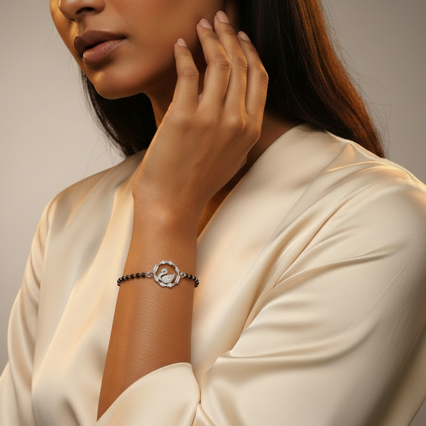 Woman wearing a delicate bracelet on a neutral background