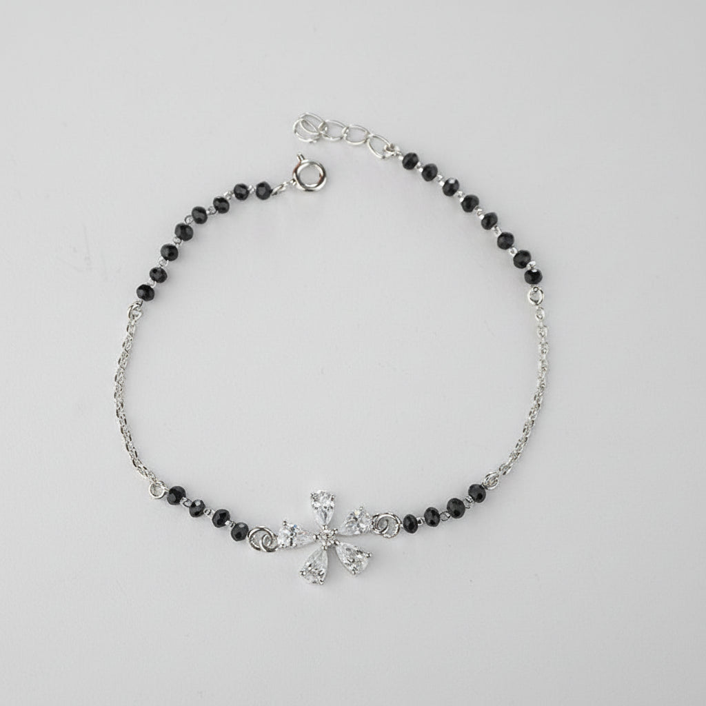 925 Sterling Silver Floral Black Bead Bracelet with black beads and silver clasp on a gray background