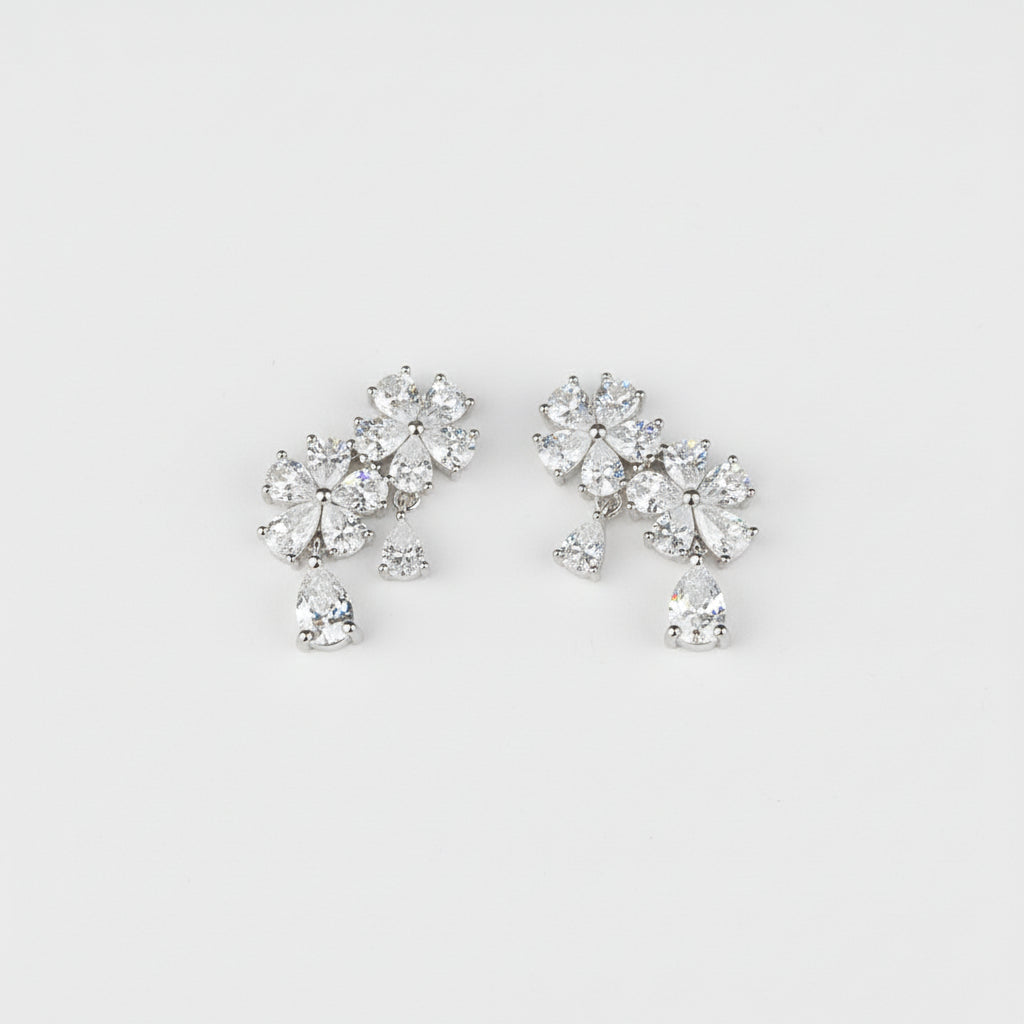 Pair of diamond earrings on a light gray background