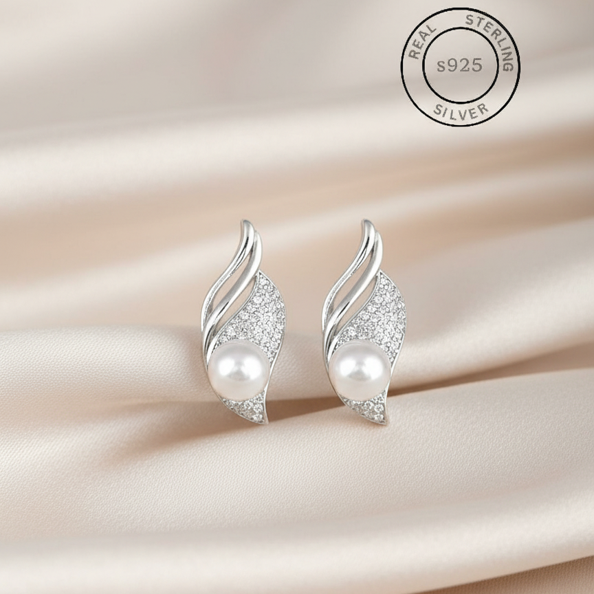 Silver earrings with pearls , featuring 'Real Sterling Silver' certification.