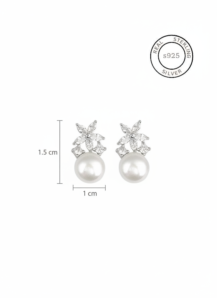 Pearl earrings with crystal accents and size measurements on a white background