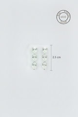 Pair of silver earrings with cubic zircon stones on a light gray background, featuring '925' stamp.