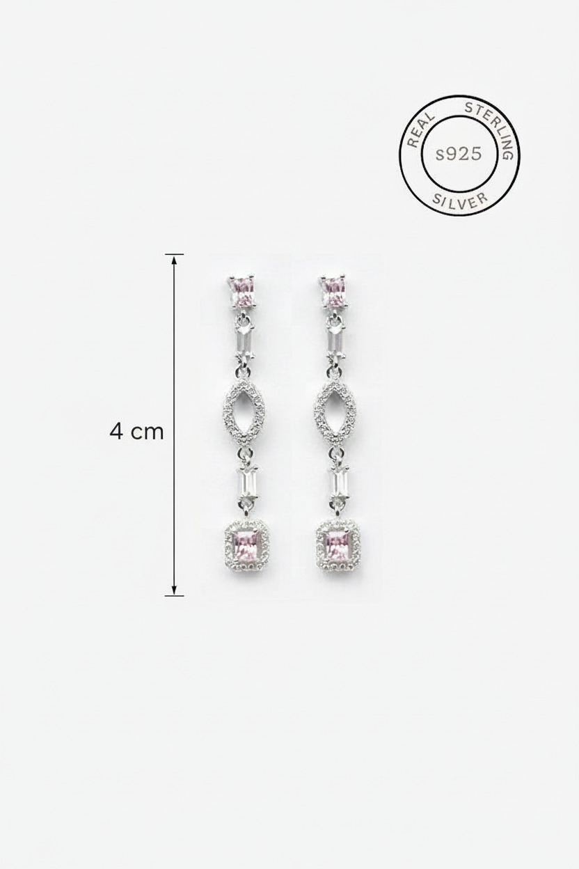 Silver earrings with pink gemstones and '925 Sterling Silver' stamp on a white background