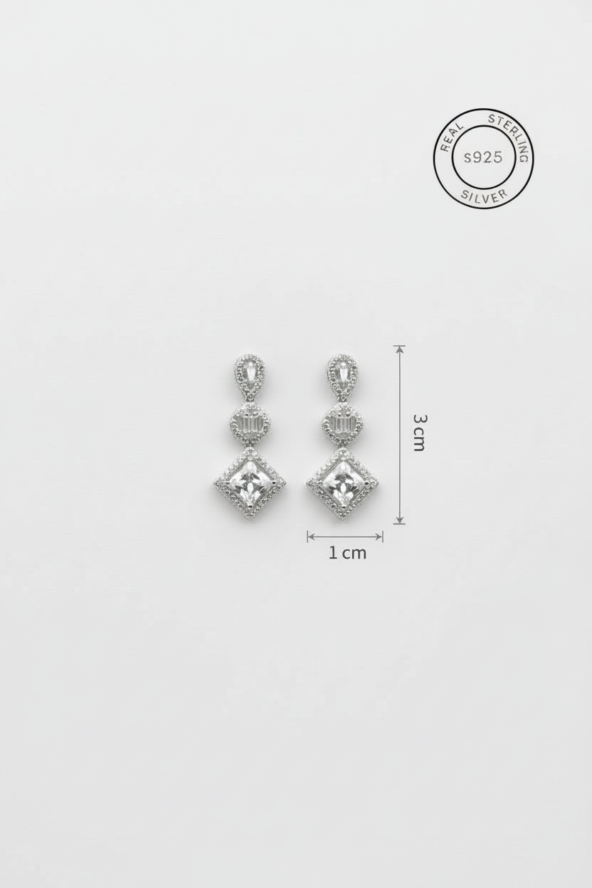 Silver earrings with clear stones and measurement details on a white background